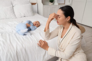 Tired mother mum baby mental health wellbeing emotional stress conflict love hate